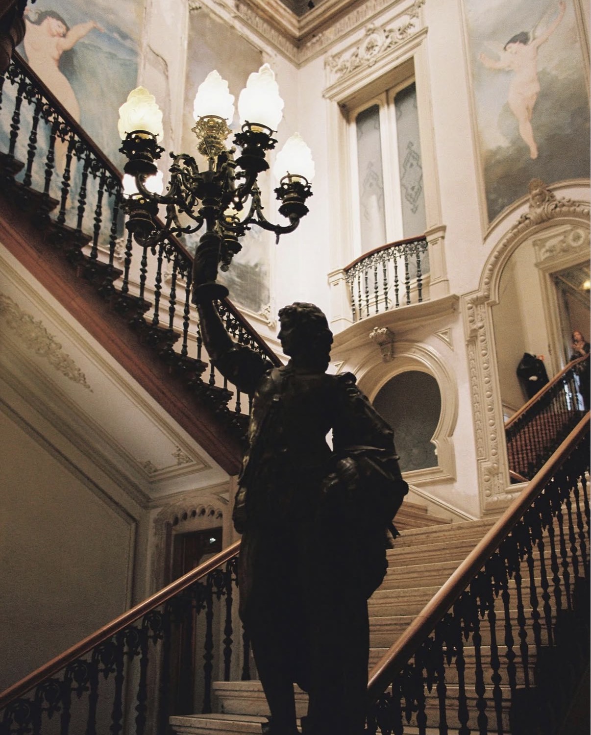 Grand staircase with bronze figure and candelabra